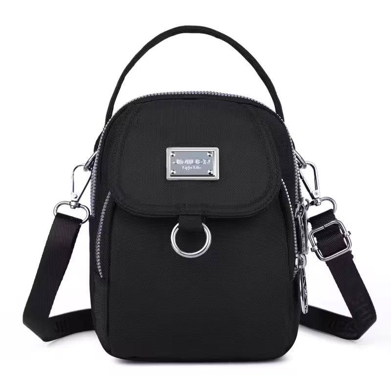 Black handbag with silver accents on a white background