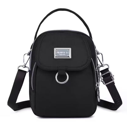 Black handbag with silver accents on a white background