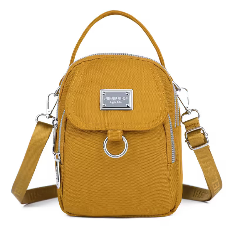 Yellow crossbody bag with a visible brand logo on a white background