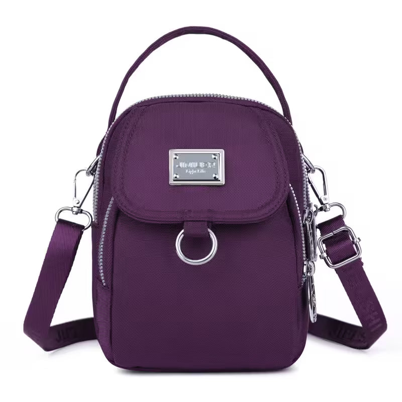 Purple handbag with a silver clasp on a white background
