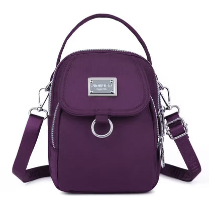 Purple handbag with a silver clasp on a white background