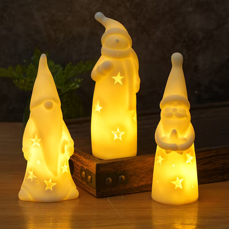 Three glowing gnome figurines on a wooden base with a dark background