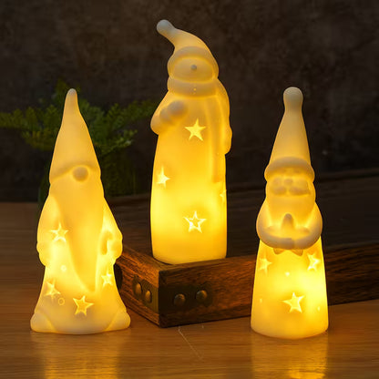 Three glowing gnome figurines on a wooden base with a dark background