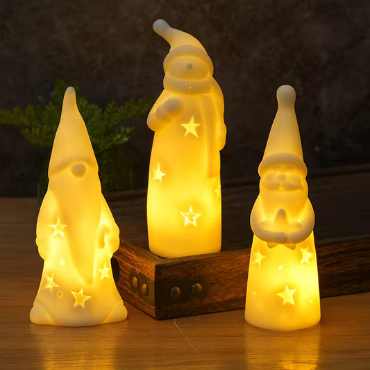 Three glowing gnome figurines on a wooden base with a dark background