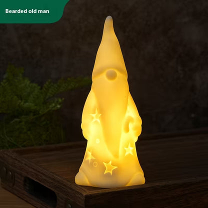 Gnome-shaped night light with a beard on a dark background