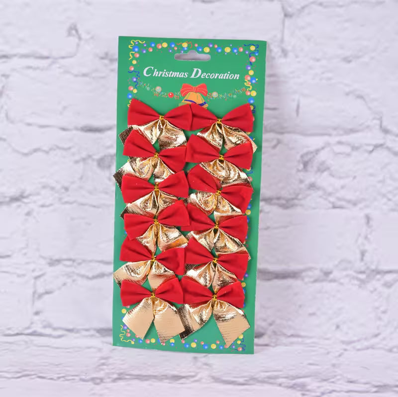 Packaged Christmas decoration with red and gold bows on a textured white background
