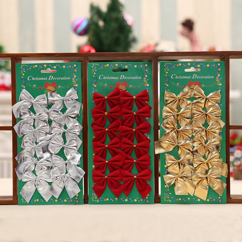 Three packages of Christmas decorations featuring silver, red, and gold bows on a green background.