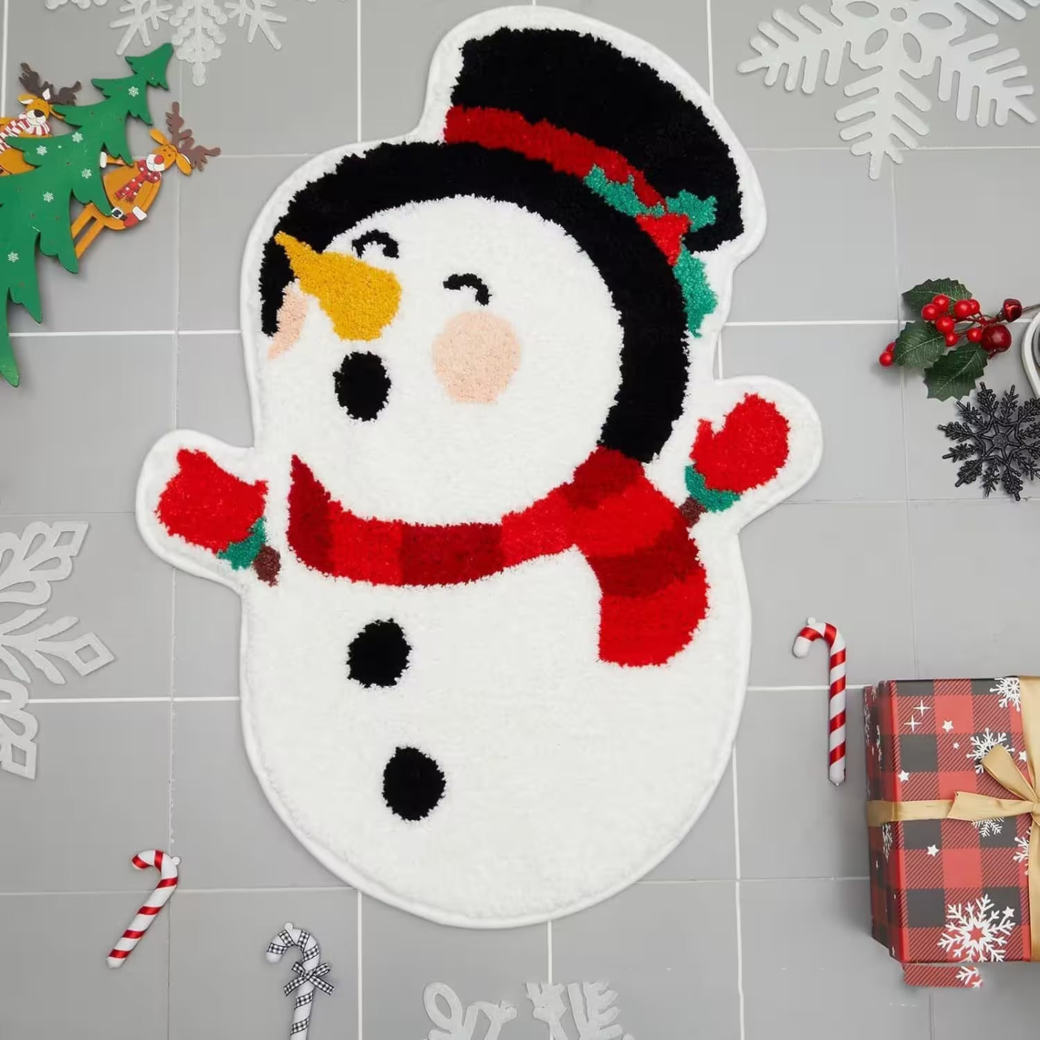 Decorative snowman rug on a gray tiled floor with Christmas decorations.