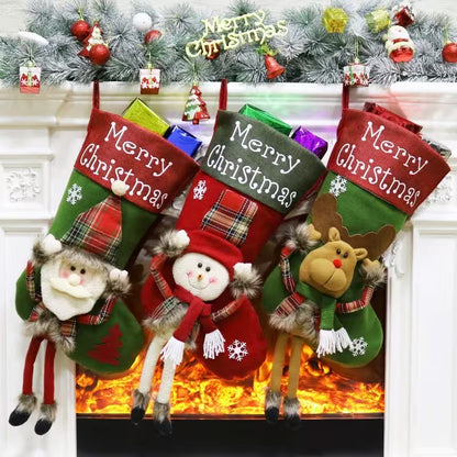 Three Christmas stockings with festive designs hanging by a fireplace.