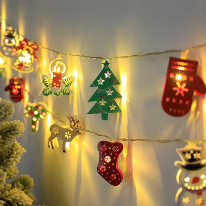 String lights with Christmas-themed decorations on a neutral background