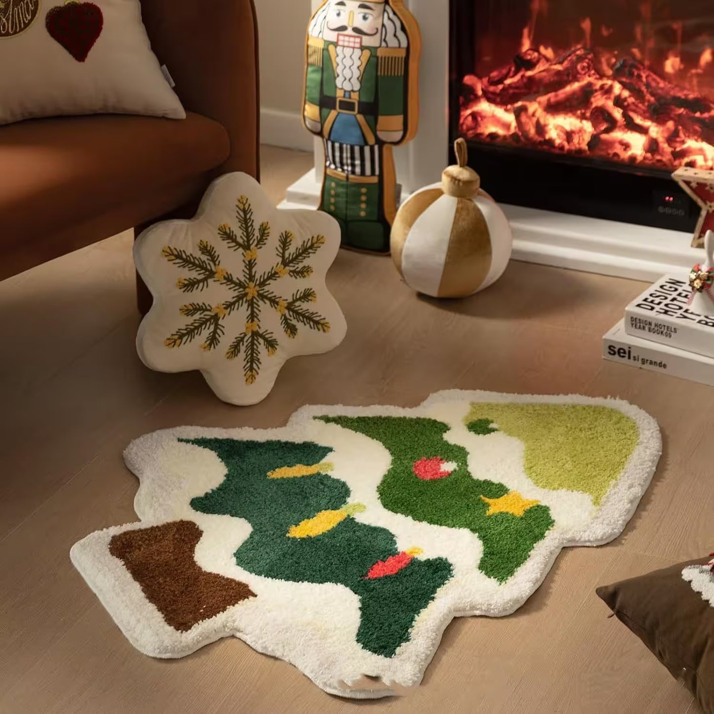 Decorative Christmas tree-shaped rug on a wooden floor with a fireplace in the background.