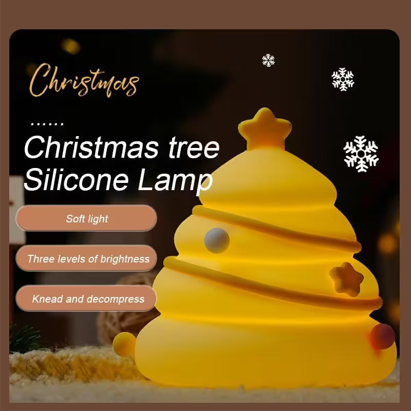 Yellow silicone Christmas tree lamp with text on a dark background