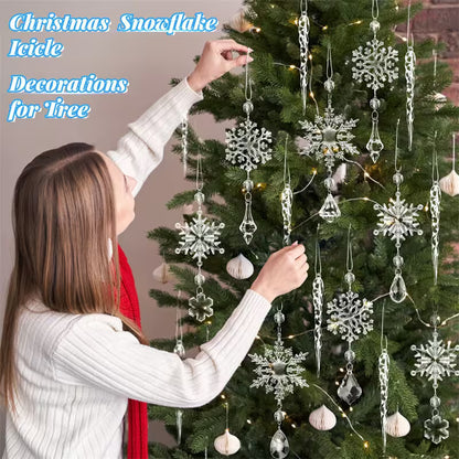 Person decorating a Christmas tree with snowflake and icicle decorations.