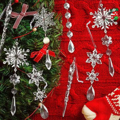 Crystal snowflake and star-shaped Christmas ornaments on a green tree with a red sweater background.