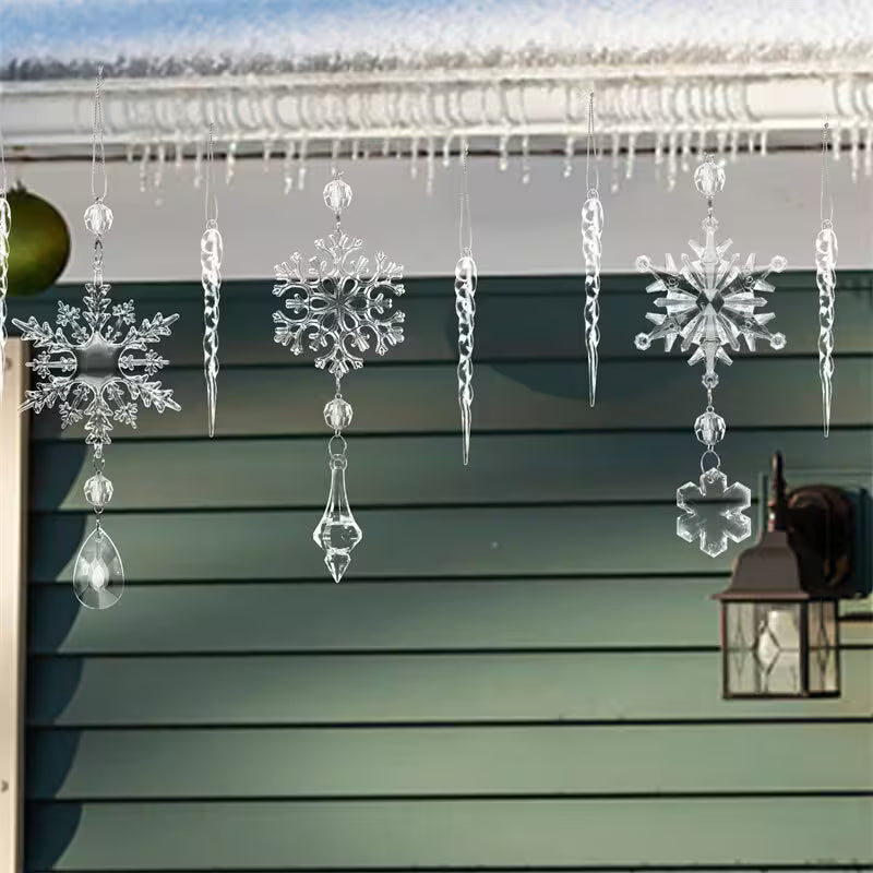 Crystal snowflake and icicle decorations hanging on a green wooden wall with a lantern.
