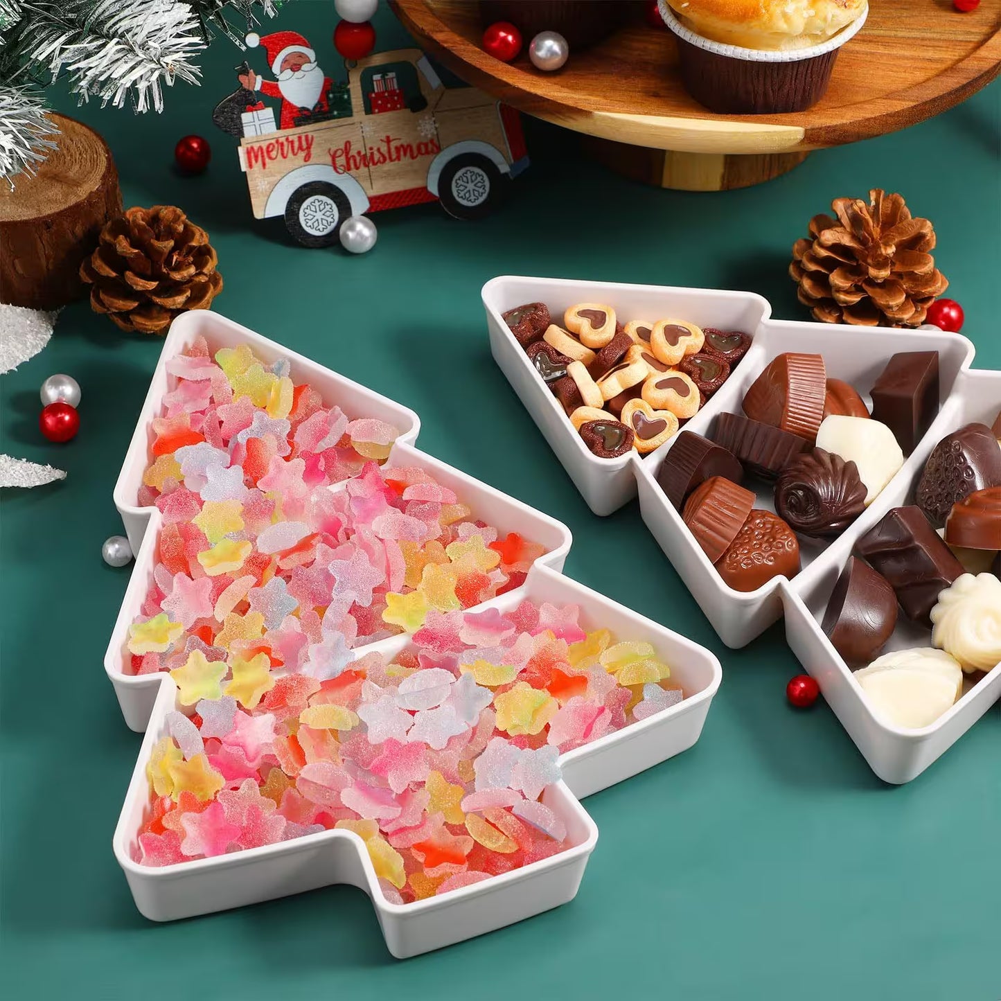 White Christmas tree-shaped bowls filled with colorful candies on a festive background.