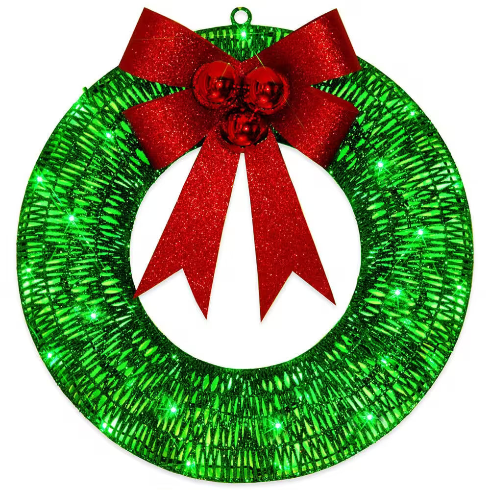 Green glittery wreath with a red bow on a white background