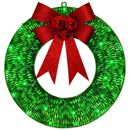 Green glittery wreath with a red bow on a white background