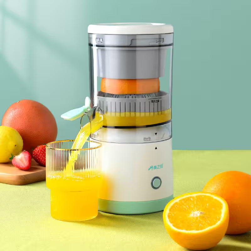 Juicer with oranges and fruits on a green background