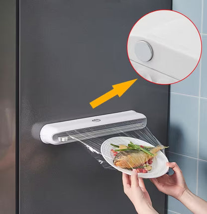 Food dehydrator on a dark surface with a close-up of the device and a hand holding a plate of food.