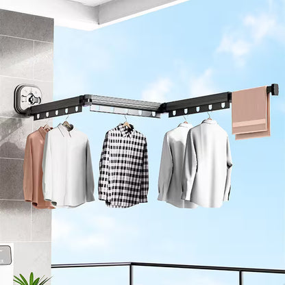 Corner clothesline with hanging clothes against a blue sky background