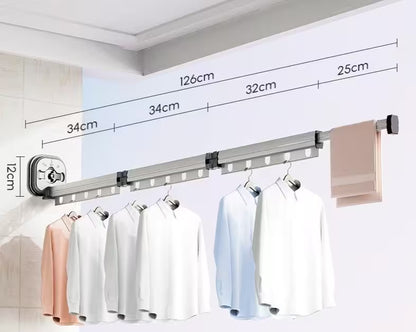 Wall-mounted clothes rack with measurement details and hanging clothes on a white background