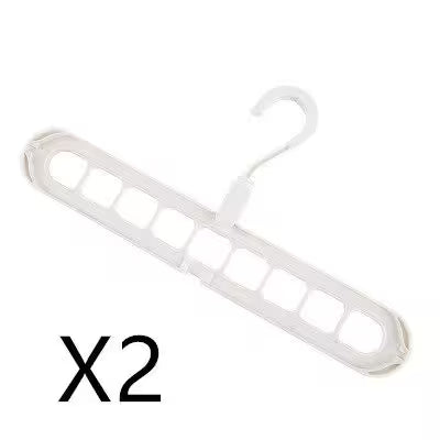 White plastic hanger with multiple hooks on a white background