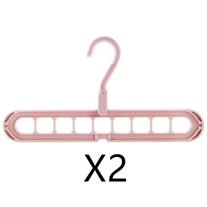 Pink hanger with multiple hooks on a white background