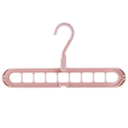 Pink plastic hanger on a white background
