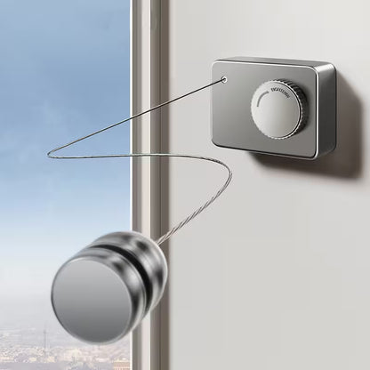 Modern doorbell system with metallic finish on a white wall