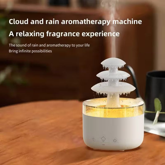 Cloud and rain aromatherapy machine on a wooden surface with text describing its features.
