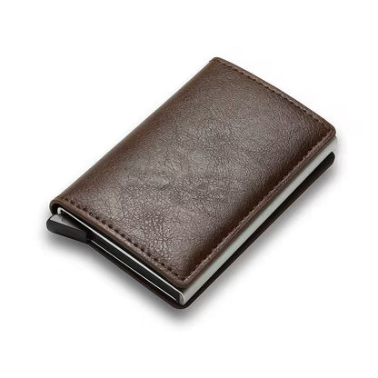 Brown leather wallet with metal clip on a white background