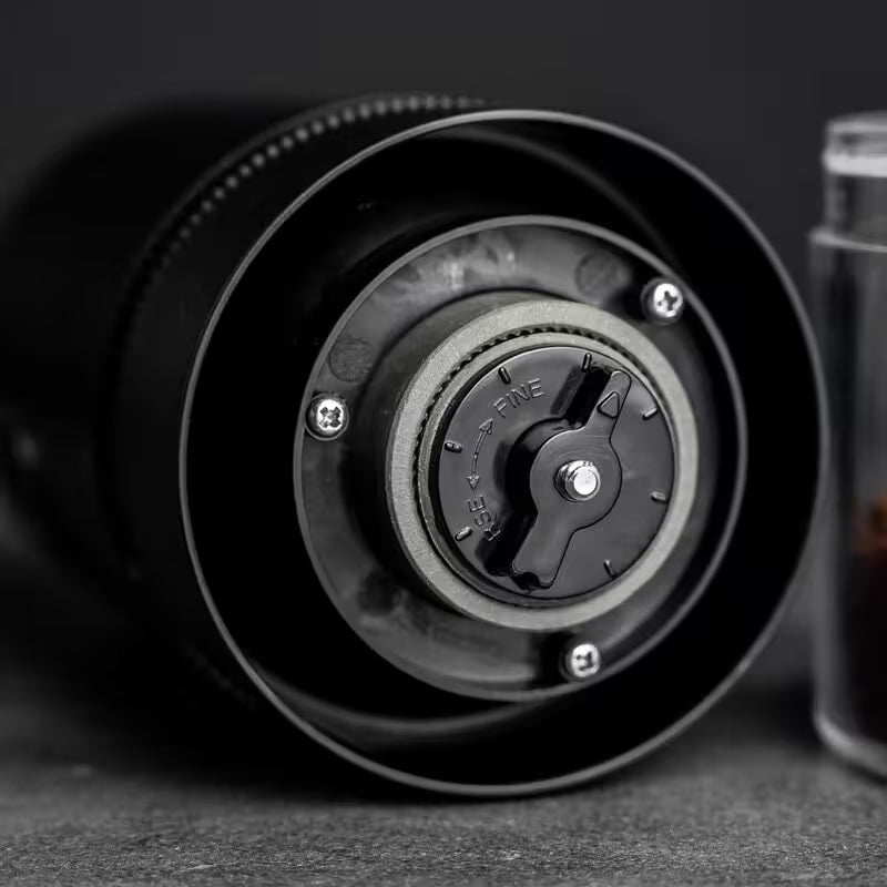 Close-up of a coffee grinder with a blurred background
