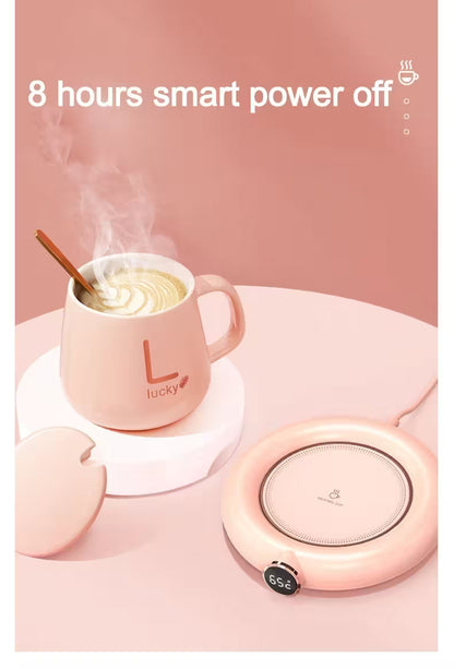 Pink mug with steaming liquid next to a circular pink device on a pink background, with text '8 hours smart power off'.