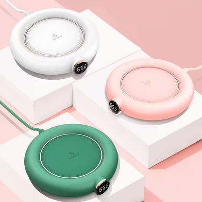 Three wireless chargers in white, pink, and green on a geometric pink and white background.