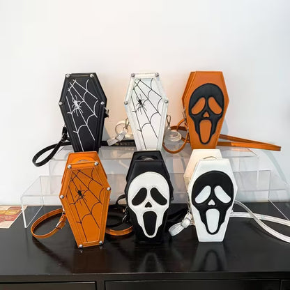Halloween-themed keychains and pouches on a clear stand with a white background