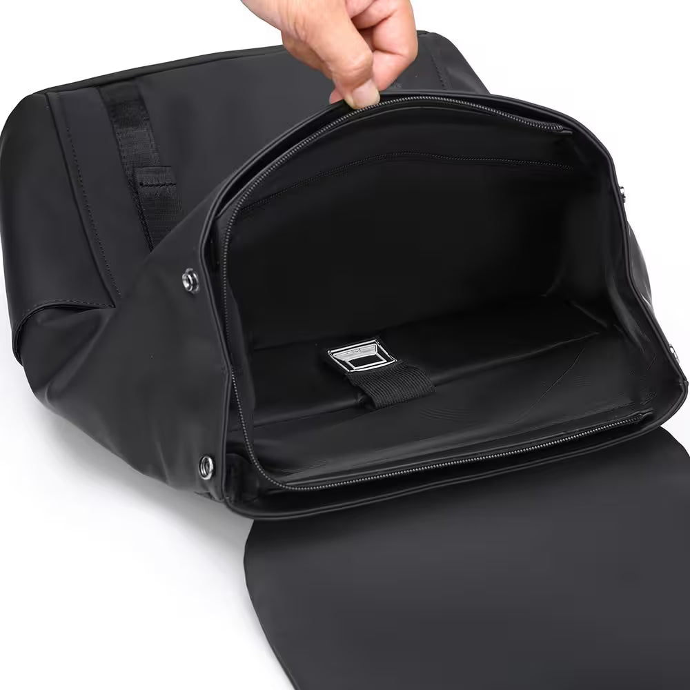 Black bag with a zipper being pulled open on a white background