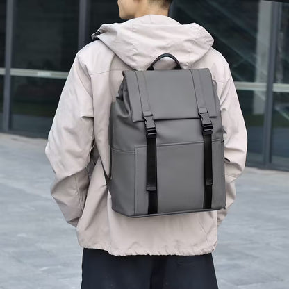 Person wearing a gray backpack with a blurred background