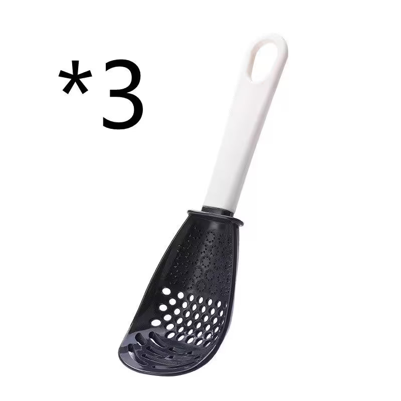 Black slotted spoon with white handle on a white background, labeled with asterisk and number three.