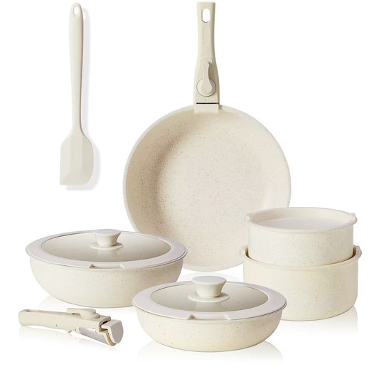 Set of ceramic cookware including pots, pans, and lids on a white background