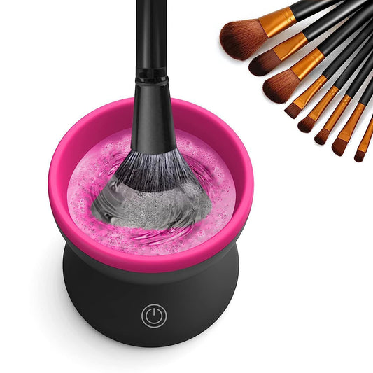 Makeup brush cleaning device with a brush in it, surrounded by additional brushes on a white background.