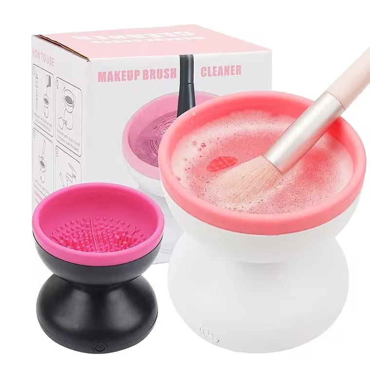 Makeup brush cleaner with pink liquid and a brush, next to its packaging.