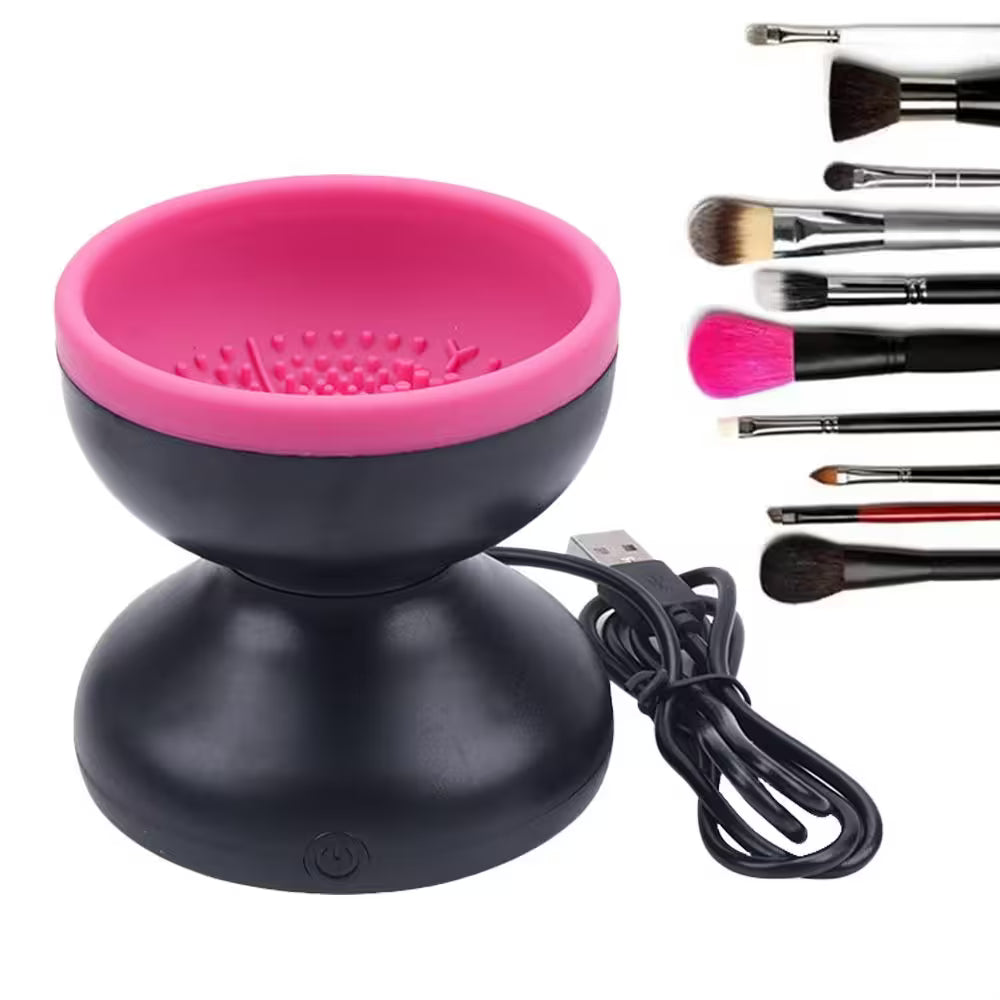 Black and pink makeup brush cleaner with USB cable and brushes on a white background