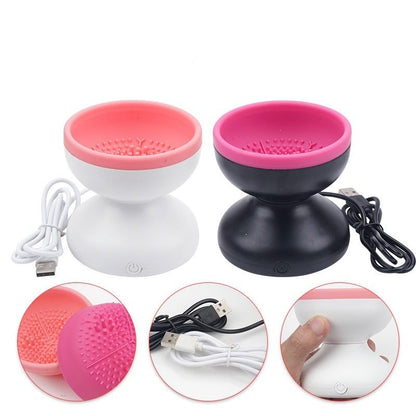 Two silicone massage balls with USB cables on a white background