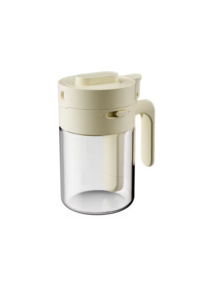 Clear glass container with beige lid and handle on a white background