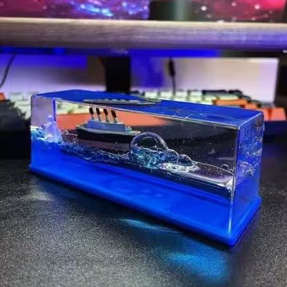 Crystal ship model on a reflective surface with a blurred background