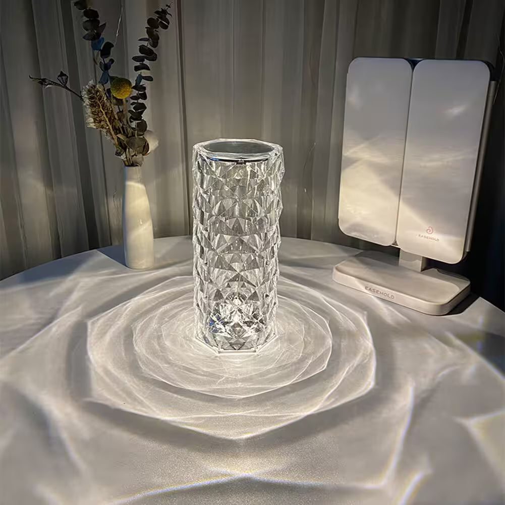 Crystal vase on a textured surface with a light source casting shadows