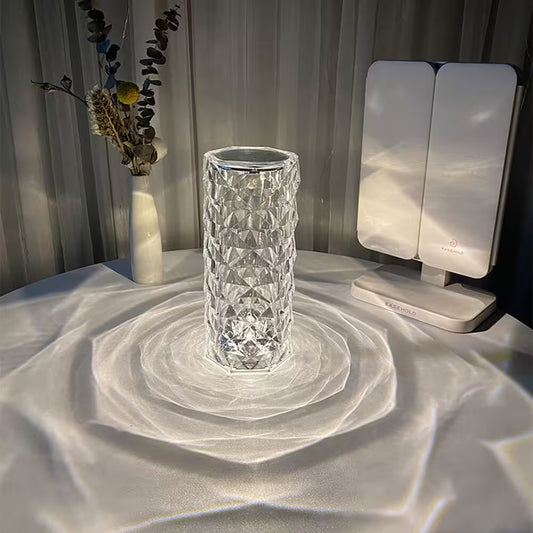 Crystal vase on a textured surface with a light source casting shadows