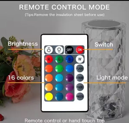Remote control with color and mode options for a decorative item, surrounded by flowers.