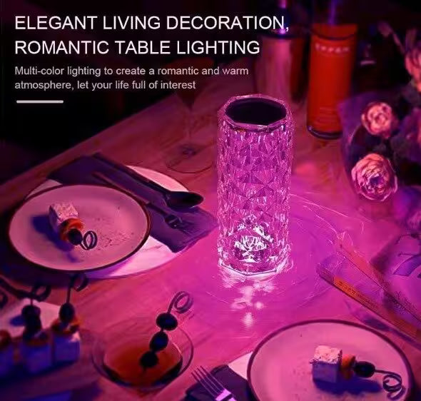 Decorative table lamp on a romantic dining setup with plates and cutlery.